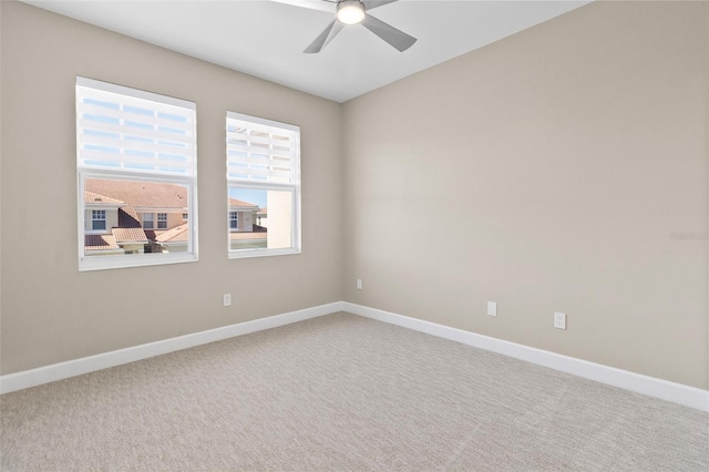 unfurnished room with carpet flooring and ceiling fan