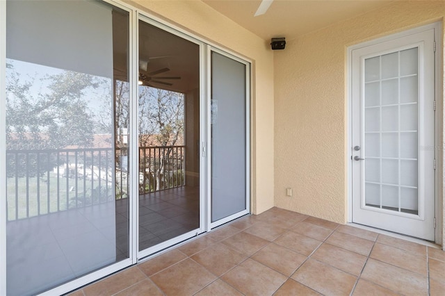 exterior space with ceiling fan