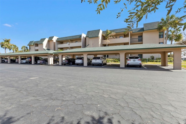 view of parking with a carport