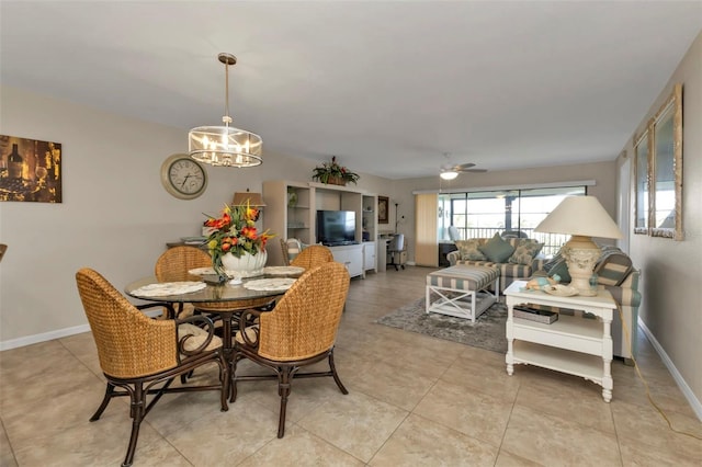 dining room featuring ceiling fan with notable chandelier and light tile patterned floors