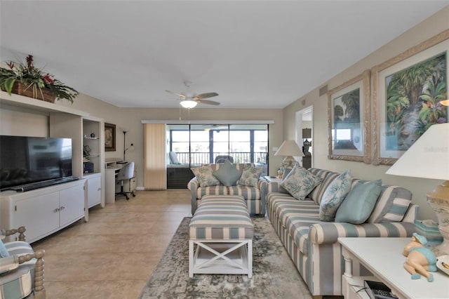 living room with ceiling fan and light tile patterned floors