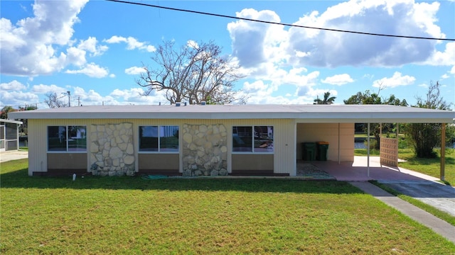 ranch-style house with a front yard and a carport