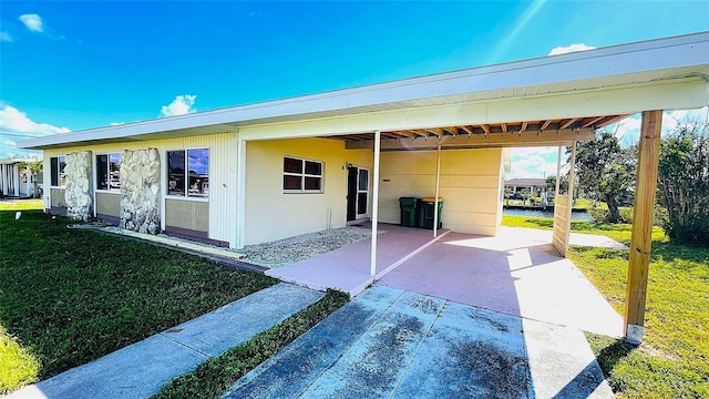 554 Lindley Ter, Port Charlotte, FL 33952 - view of front of property featuring a front yard and an attached carport