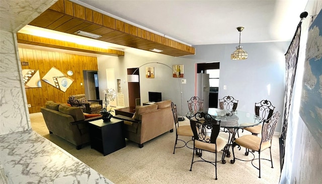 living room with wood walls