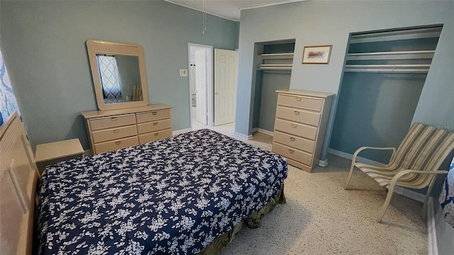 554 Lindley Ter, Port Charlotte, FL 33952 - bedroom featuring attic access, multiple closets, baseboards, and crown molding