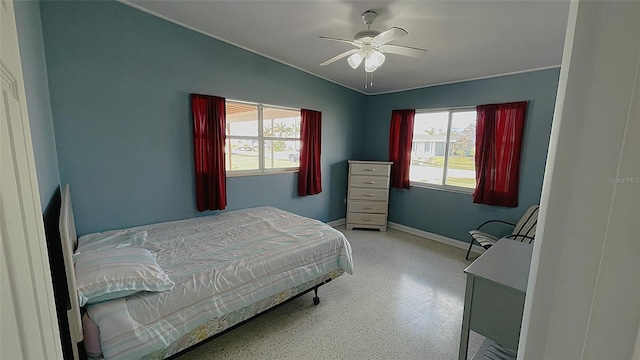 bedroom with lofted ceiling and ceiling fan