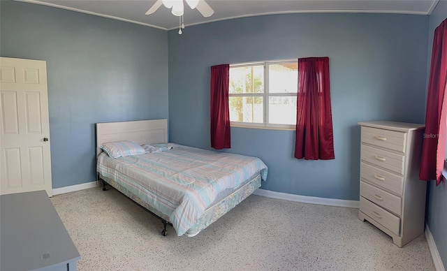 554 Lindley Ter, Port Charlotte, FL 33952 - bedroom featuring baseboards, speckle patterned floor, and ceiling fan