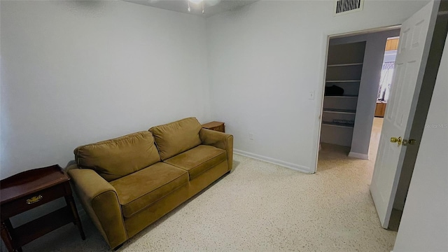 554 Lindley Ter, Port Charlotte, FL 33952 - living room with dark aggregate flooring, a ceiling fan, and baseboards