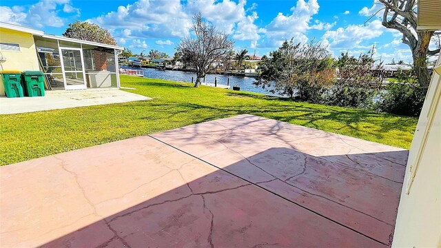554 Lindley Ter, Port Charlotte, FL 33952 - view of patio with a water view and a sunroom
