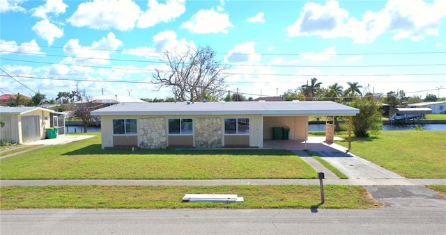 554 Lindley Ter, Port Charlotte, FL 33952 - view of front of property featuring driveway, a front lawn, and a carport