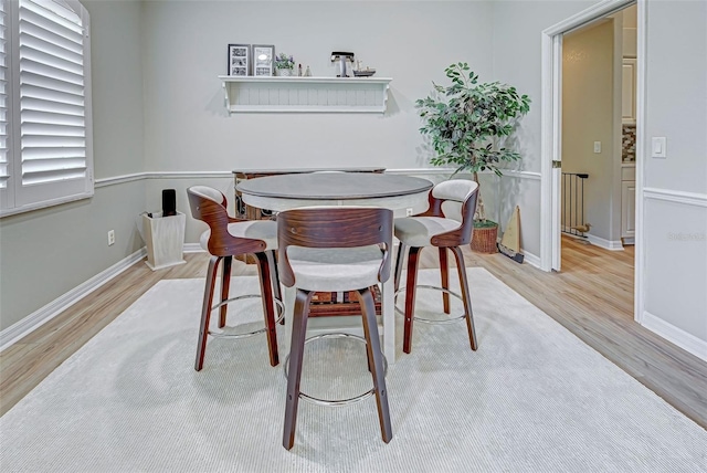 dining space featuring light wood-type flooring