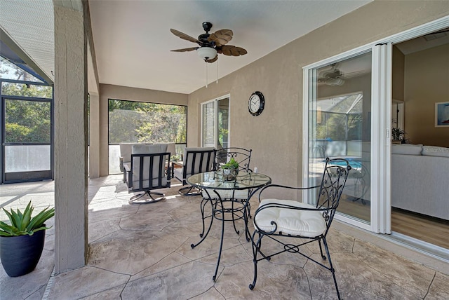 sunroom with ceiling fan