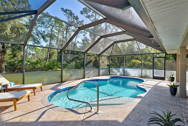 view of pool with a lanai and a patio area