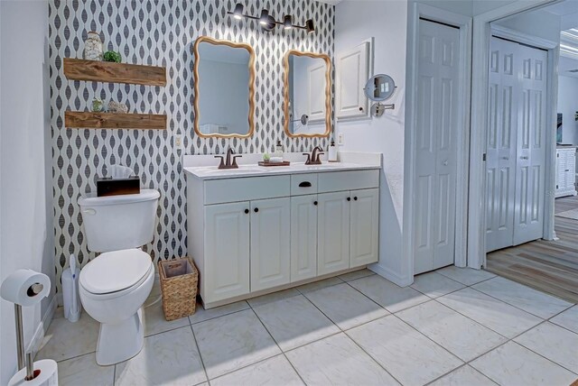 bathroom featuring vanity and toilet