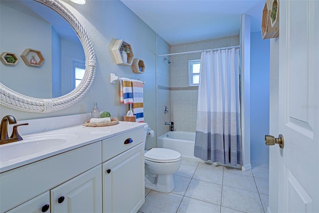 full bathroom featuring tile patterned flooring, vanity, toilet, and shower / tub combo with curtain