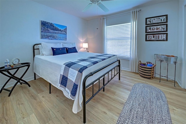 bedroom featuring ceiling fan and light hardwood / wood-style floors