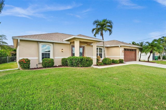 view of front facade featuring a garage and a front yard