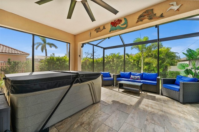 sunroom / solarium featuring ceiling fan