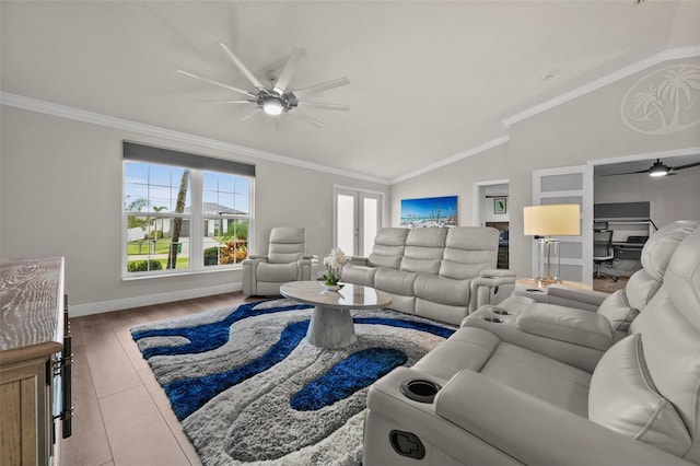 living room with light hardwood / wood-style floors, ceiling fan, crown molding, and vaulted ceiling