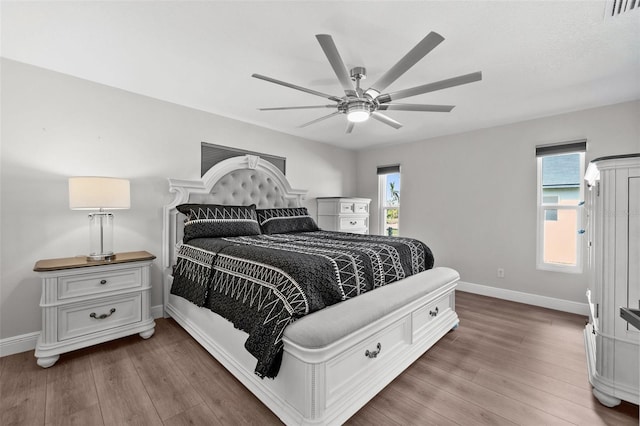 bedroom featuring hardwood / wood-style floors and ceiling fan