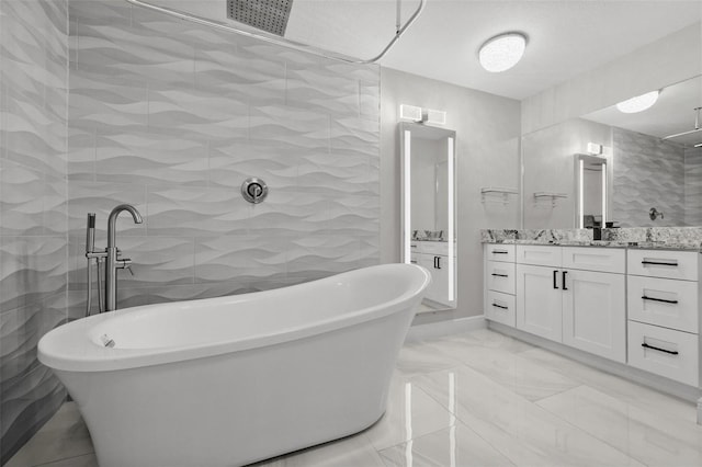 bathroom featuring tile walls, shower with separate bathtub, and vanity