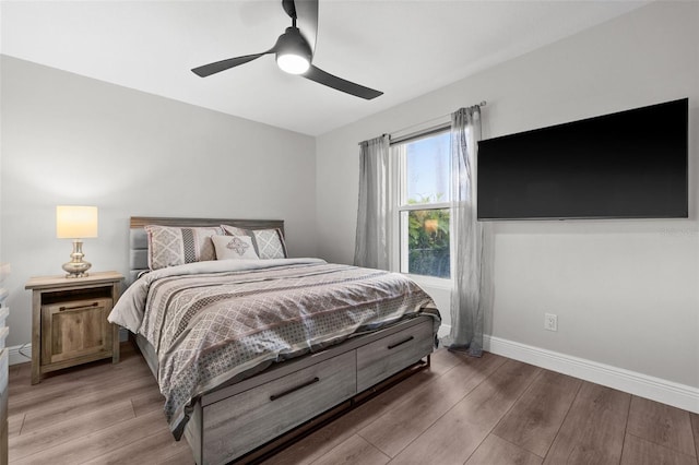 bedroom with hardwood / wood-style flooring and ceiling fan