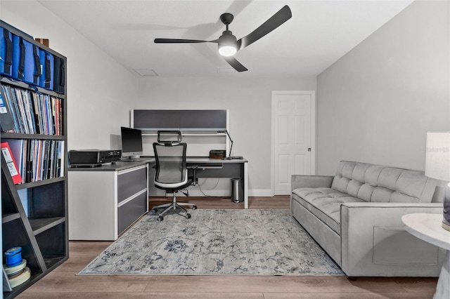 office space featuring wood-type flooring and ceiling fan