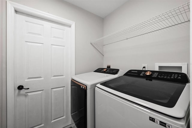 washroom with washer and clothes dryer