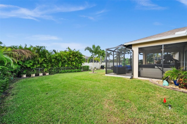 view of yard with a sunroom and a patio area