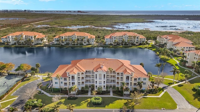 birds eye view of property featuring a water view