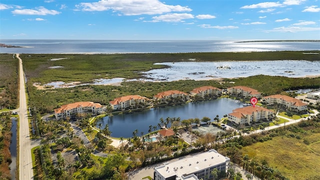 birds eye view of property with a water view