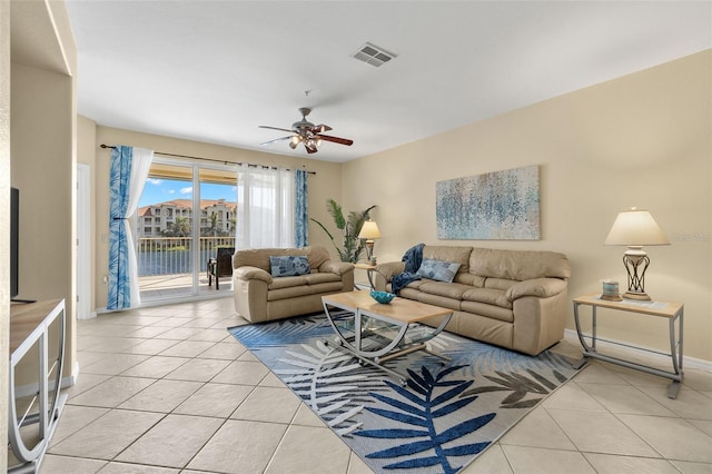 tiled living room featuring ceiling fan