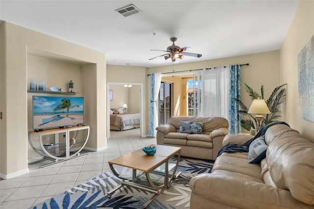 tiled living room with ceiling fan