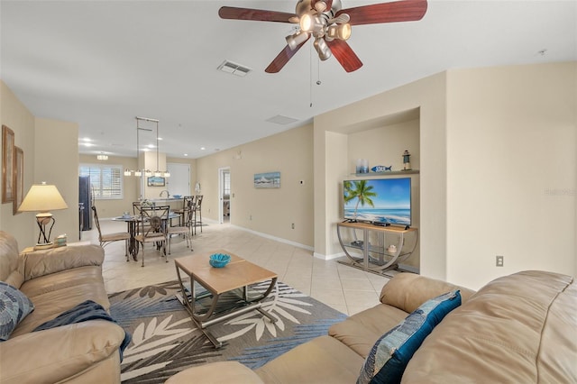 tiled living room with ceiling fan