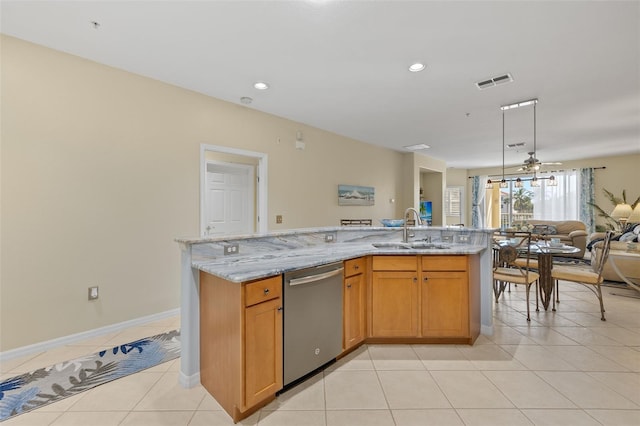 kitchen featuring light tile patterned floors, light stone countertops, sink, stainless steel dishwasher, and ceiling fan