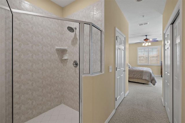 bathroom with walk in shower and ceiling fan