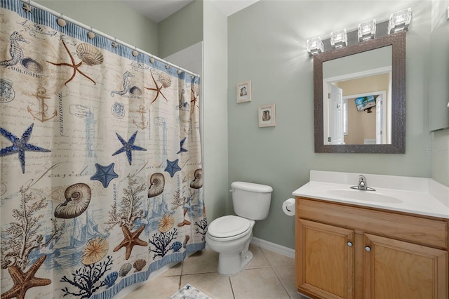 bathroom featuring toilet, vanity, a shower with shower curtain, and tile patterned flooring