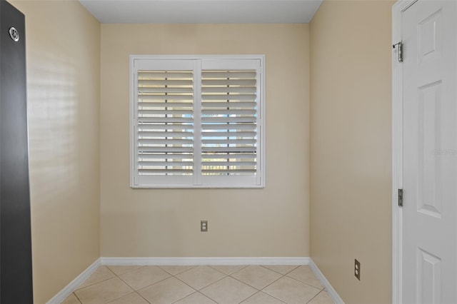 empty room with light tile patterned flooring