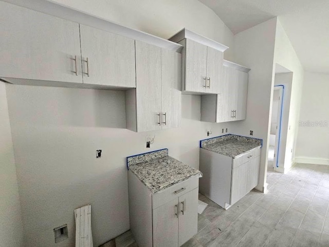 kitchen with radiator and baseboards