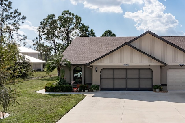 view of front facade with a garage and a front yard