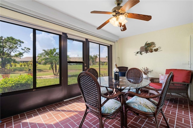 sunroom / solarium with ceiling fan