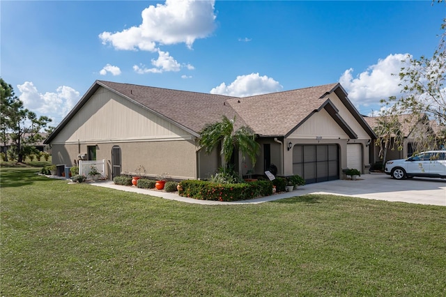 view of front of home with a garage and a front yard