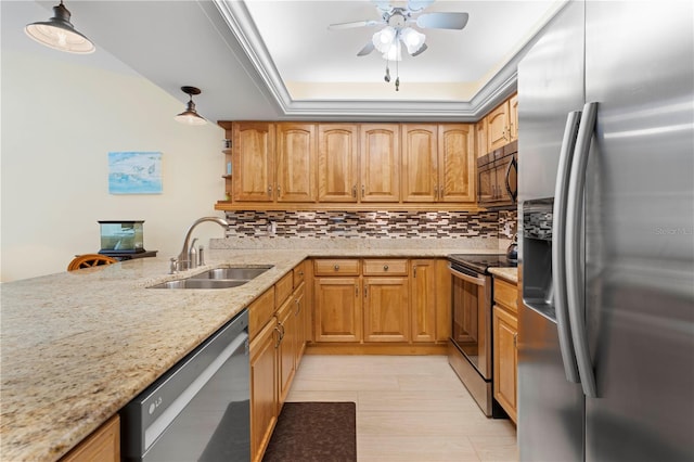 kitchen featuring pendant lighting, decorative backsplash, stainless steel appliances, and sink