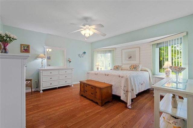 bedroom with hardwood / wood-style flooring and ceiling fan