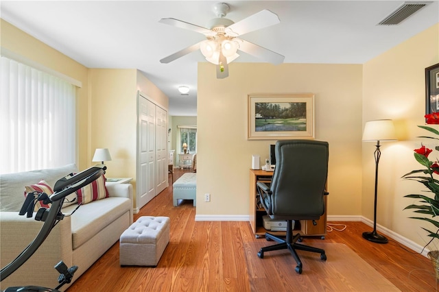 office with ceiling fan and wood-type flooring