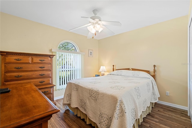 bedroom featuring dark hardwood / wood-style flooring and ceiling fan