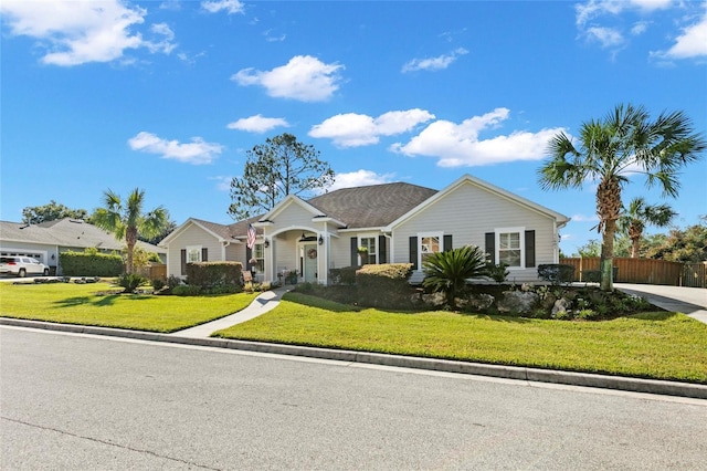 single story home with a front lawn