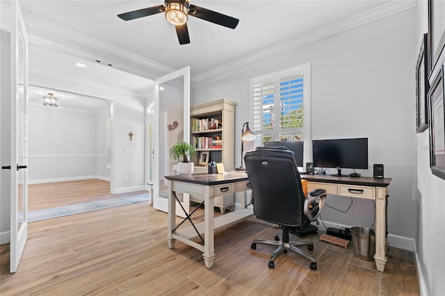 office space featuring light hardwood / wood-style floors, ceiling fan, and crown molding