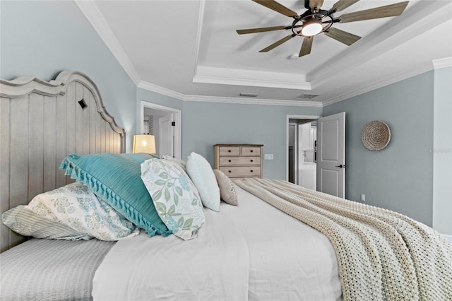 bedroom featuring ceiling fan, a raised ceiling, and ornamental molding