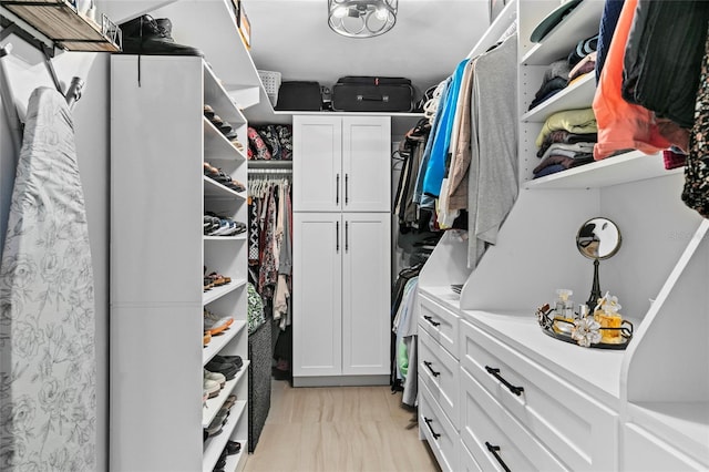 walk in closet featuring light wood-type flooring